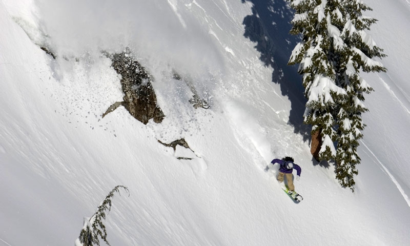 Snowboarding a steep line at Squaw Valley Ski Resort